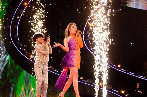 The judging panel of The Voice of Poland observing a performance.