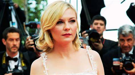 Kirsten Dunst wearing period costume for a movie
