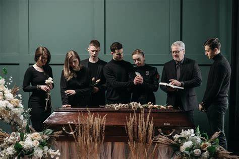 A group of people engaged in storytelling and celebration at an Irish wake.
