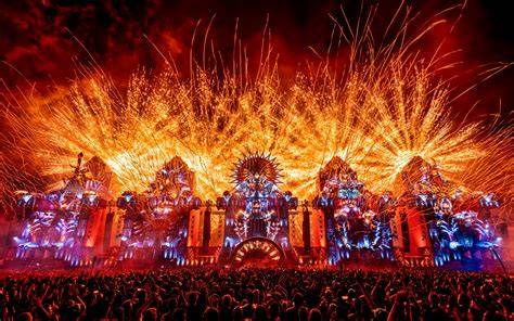 A stage at Defqon.1 featuring DJs performing to an enthusiastic crowd.