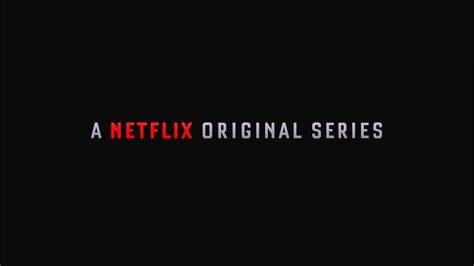 A laptop showing classic Netflix original series like 'House of Cards'.