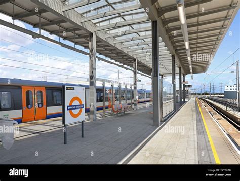 The Barking Riverside Overground station with trains arriving.