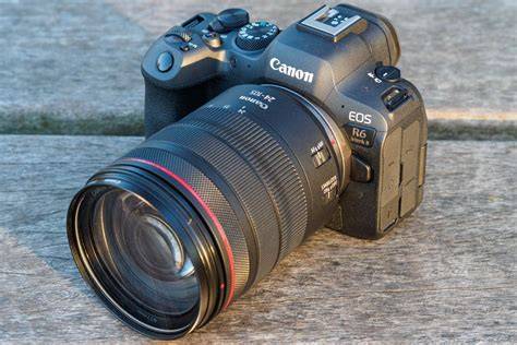 The Canon EOS R6 Mark II camera showcased on a table at a photography event.