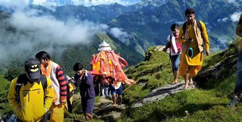 Pilgrims enjoying the Nanda Devi Raj Jat trek in late summer with vibrant greenery.