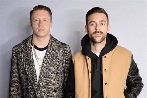 Macklemore & Ryan Lewis in a music video discussing social themes