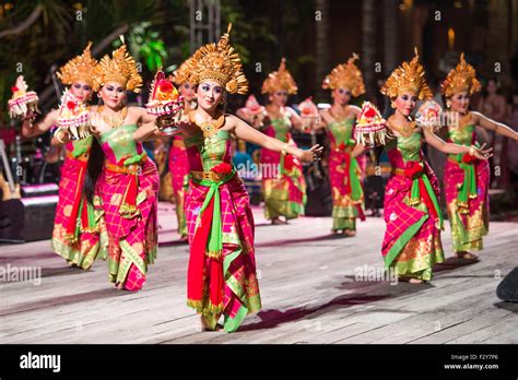 People in traditional Indonesian clothing celebrating at a festival.