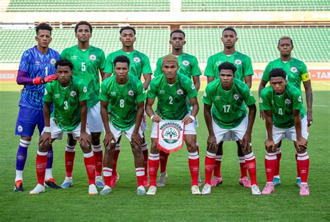 Madagascar national football team players competing in an AFCON match against another national team.