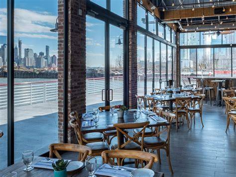 A bustling street in Downtown Jersey City featuring trendy restaurants and shops.