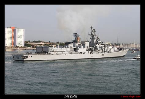 INS Delhi destroyer participating in a naval exercise with other ships.