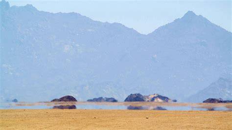 A visual representation of a temperature inversion causing a superior mirage.