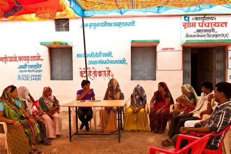 Residents of Chauth Ka Barwara discussing community issues with Panchayat Samiti members during a meeting.