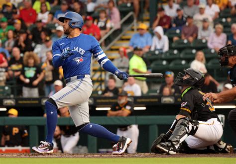 Baseball players celebrating as they reach significant career hit milestones during a game.
