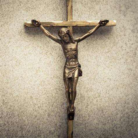 A Christian crucifix hanging on a wall in a church.